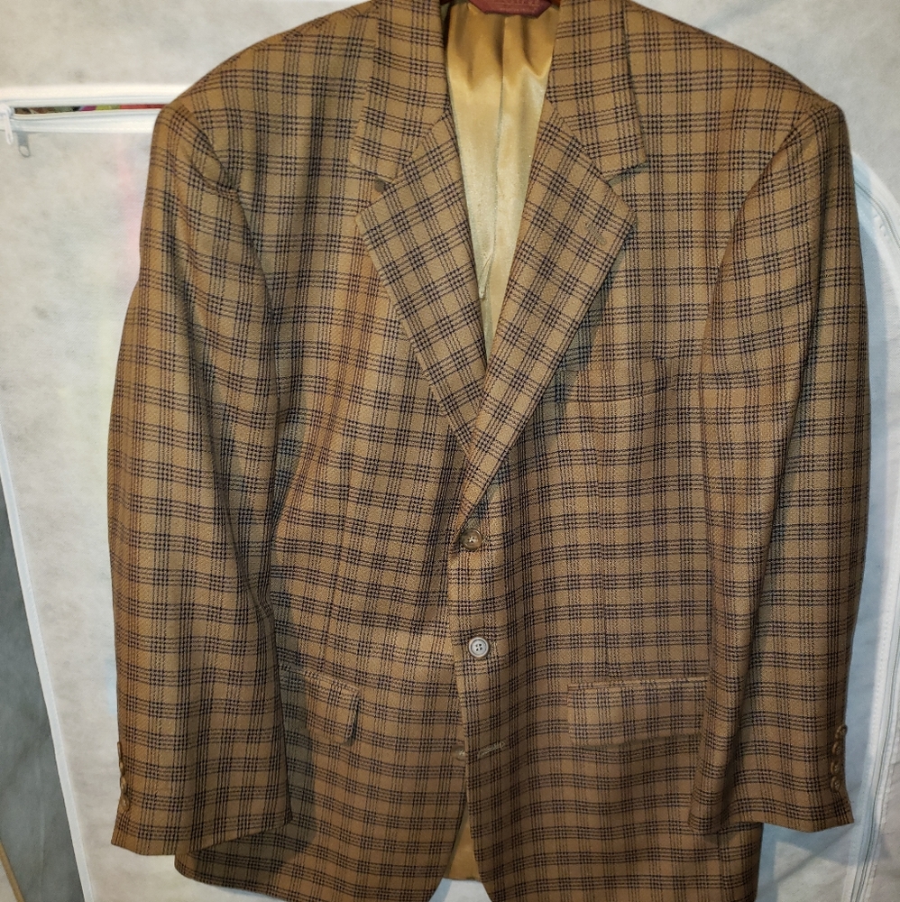 3 button bronze with blue checkerboard ventless back sport jacket.